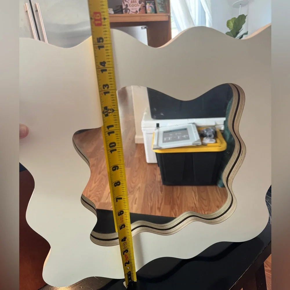 Small wavy cut mirror. Cream color. Like new.